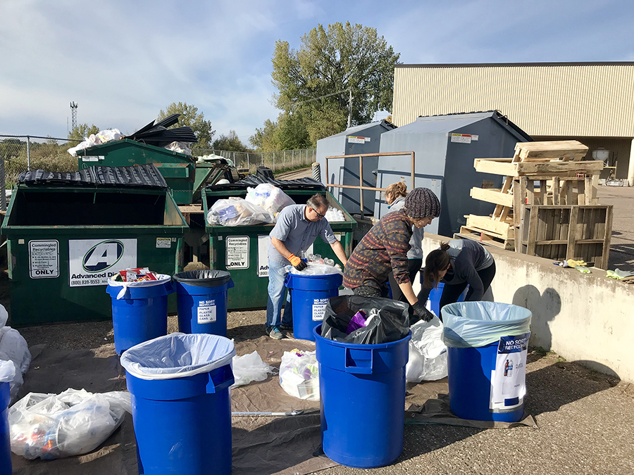 Members of the UW-Stout Waste Reduction Work Group conduct audits of recycling bins.