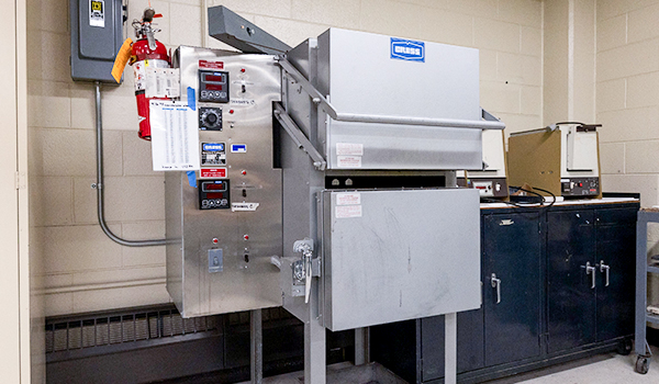 Heat treating oven in engineering lab.