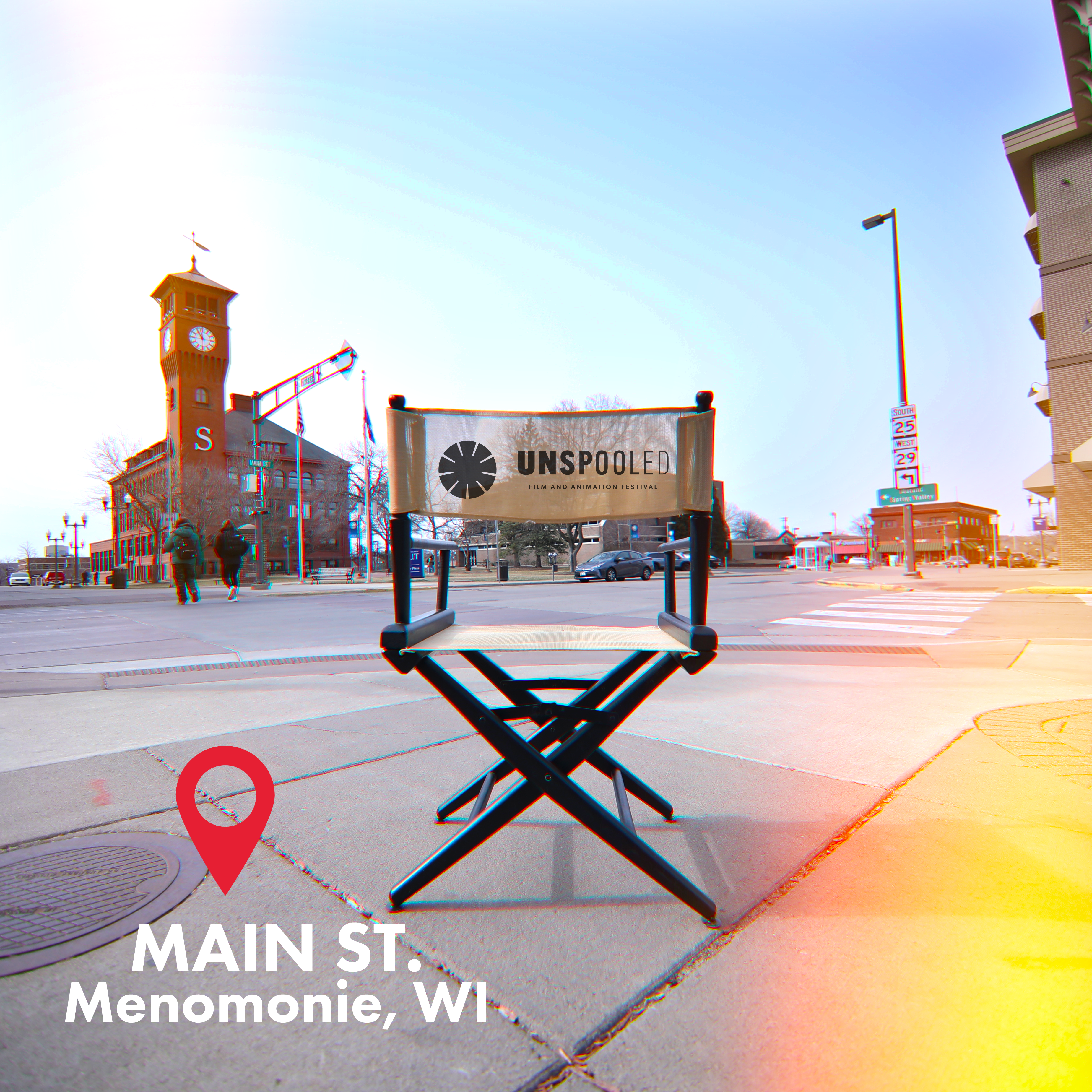 Direct Your Stay at Unspooled Film and Animation Festival - Directors chair sitting on the corner of main street Menomonie, facing the UW-Stout Bell Tour