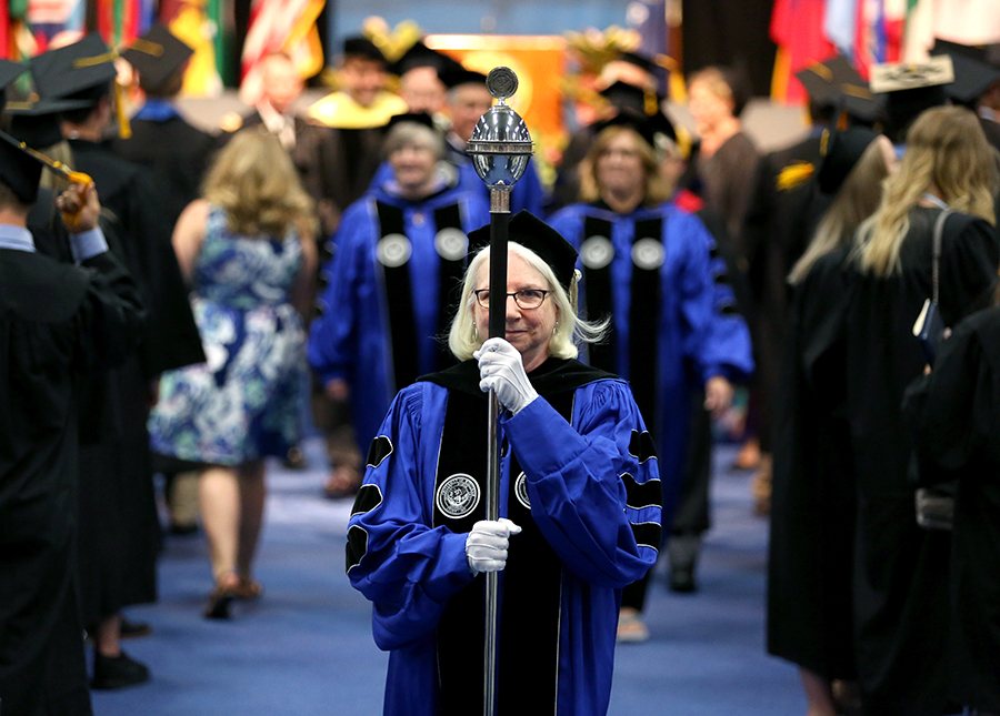 Loreta Thielman says she loves looking at how happy graduates are