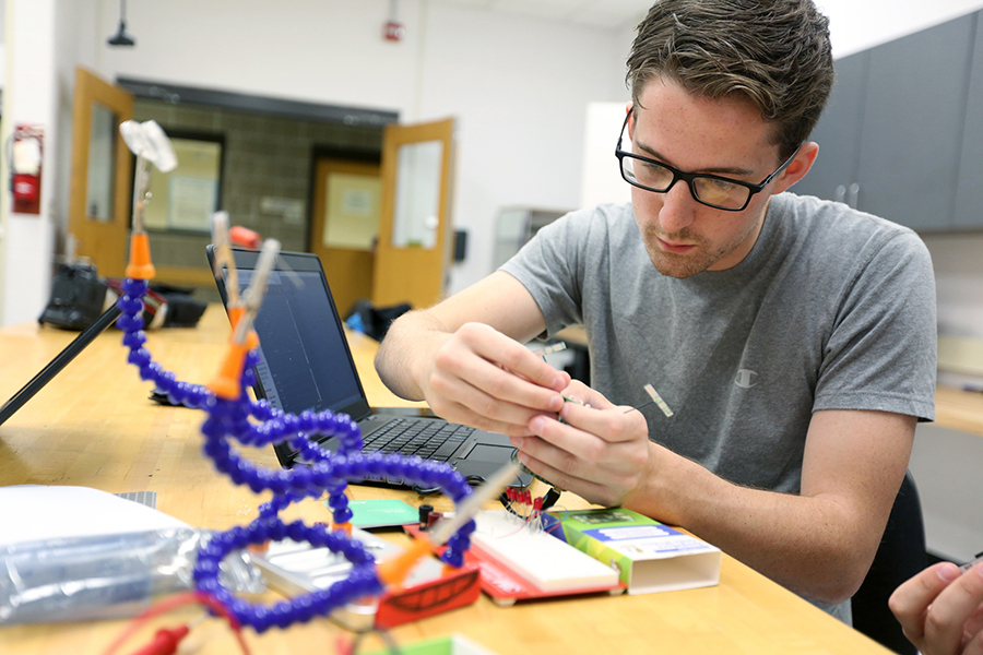 A computer engineering student works in a Fryklund Hall lab at UW-Stout.