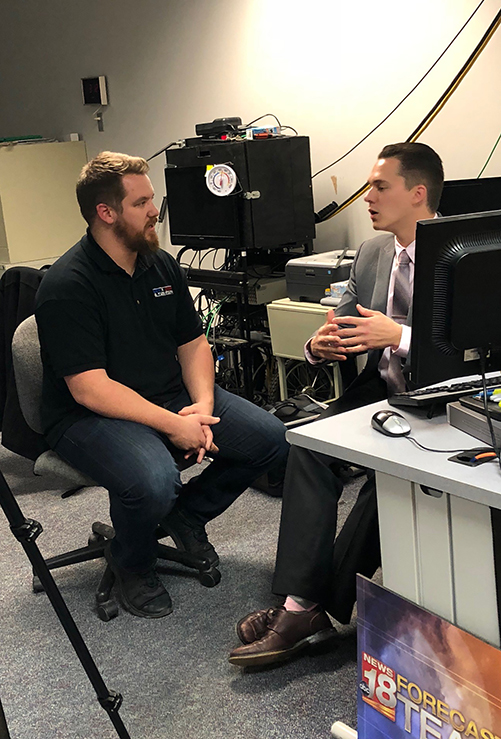 Domanick Bainey, left, interviews WQOW TV 18 meteorologist Justin Esterly for a segment of “Exploring America.”