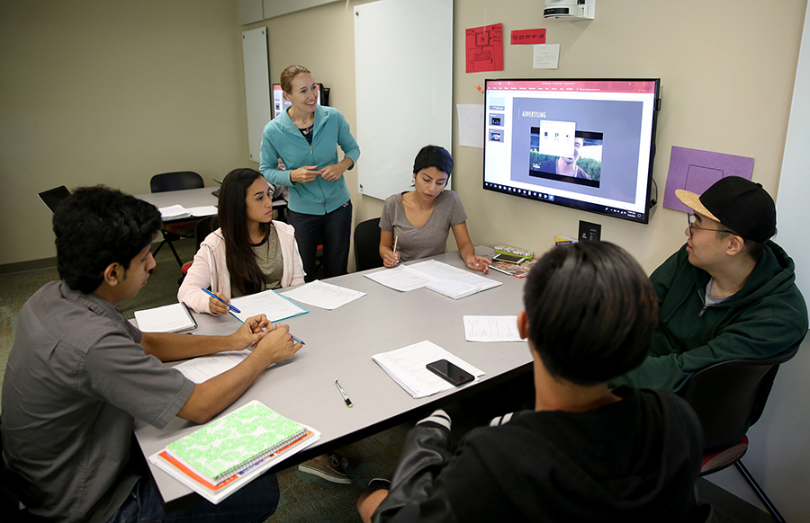 Instructor Pamela Onchuck works with students at UW-Stout’s English as a Second Language Institute. Second from left is Gladymar Betancourt of Puerto Rico.