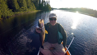 Bob Meyer holds a walleye he caught while on the trip.