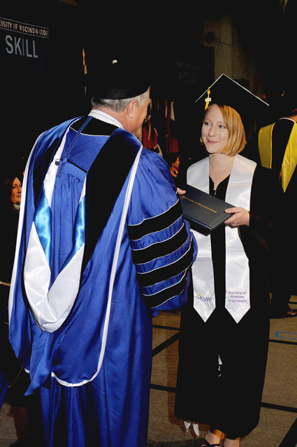 Jasmine Rothbauer receives congratulations from Chancellor Bob Meyer at UW-Stout’s December graduation.