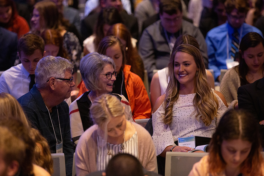 Kallie Taylor, a senior from Forest Lake, Minn., talks at the scholarship program with Mike and Lucy Nicolai. Taylor received a Wisconsin in Scotland scholarship sponsored by the Nicolais.