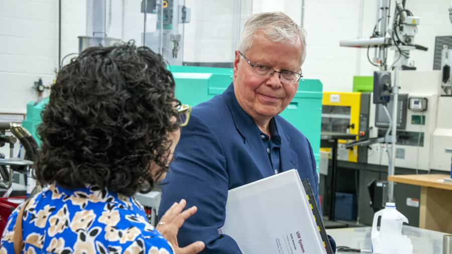 Provost Glendali Rodriguez talks with Jay Rothman during his stop in the university’s plastics engineering lab in Jarvis Hall Technology Wing.