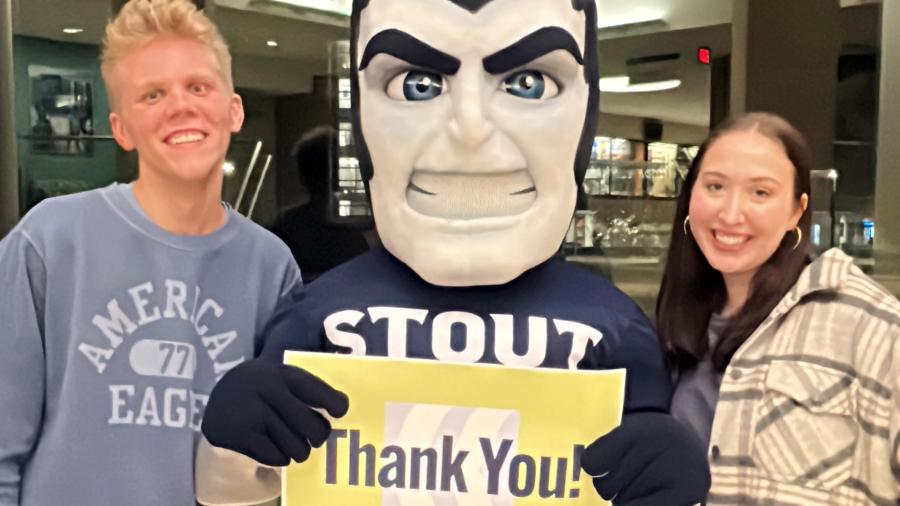 Students Braeden Lange and Maria Winkelman, along with Blaze, the Blue Devil mascot, thank those who supported UW-Stout on Giving Day. The students work for Blue Devil Productions in the Involvement Center on campus.