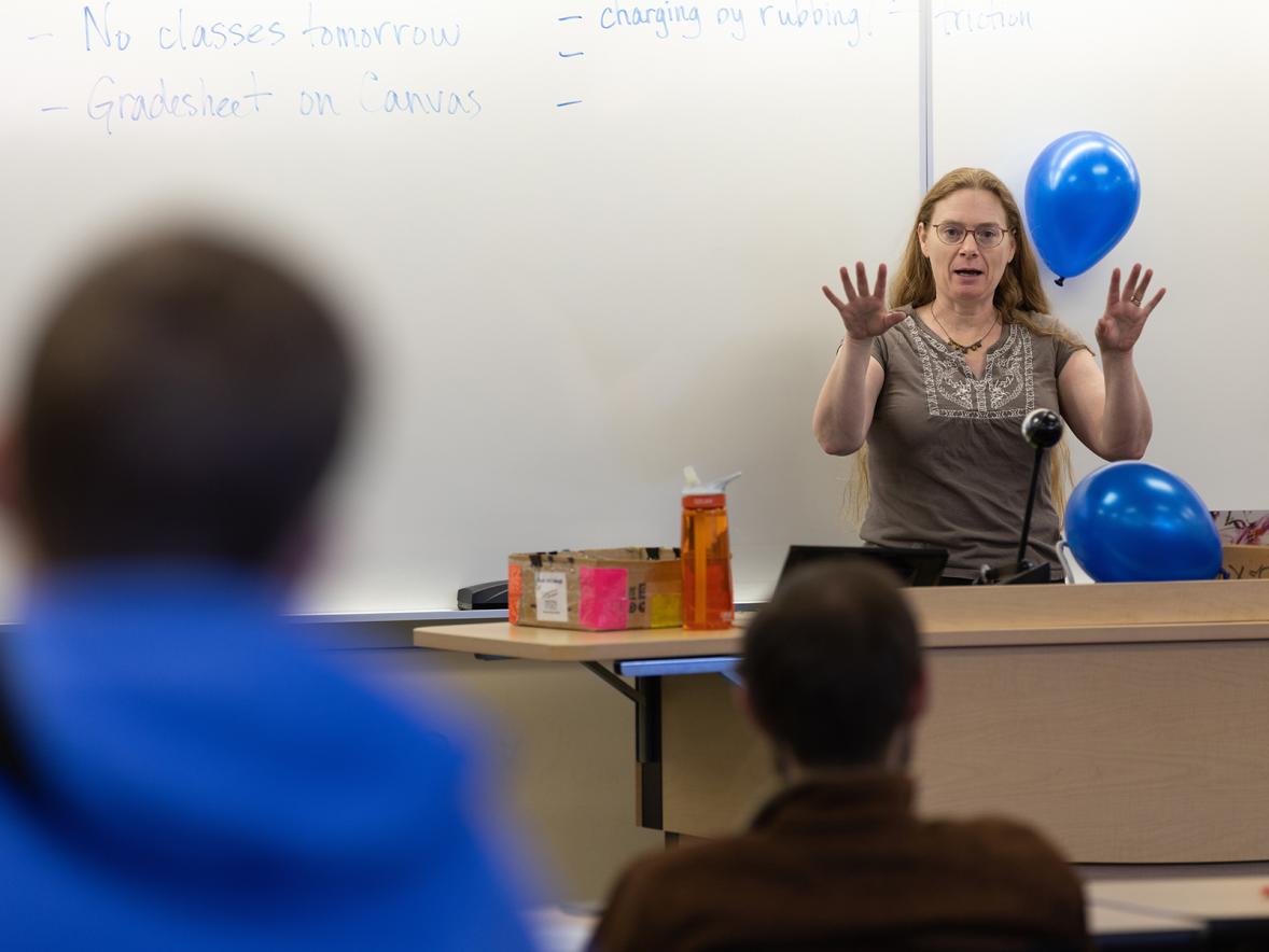 Professor Laura McCullough uses balloons in a physics class this spring to help students learn about static electricity. 