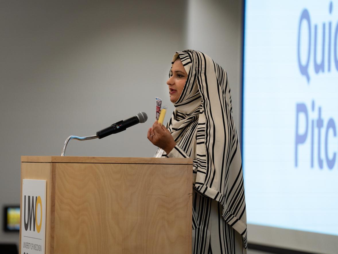 Areeba Ali presenting at WiSys SPARK Symposium's Quick Pitch