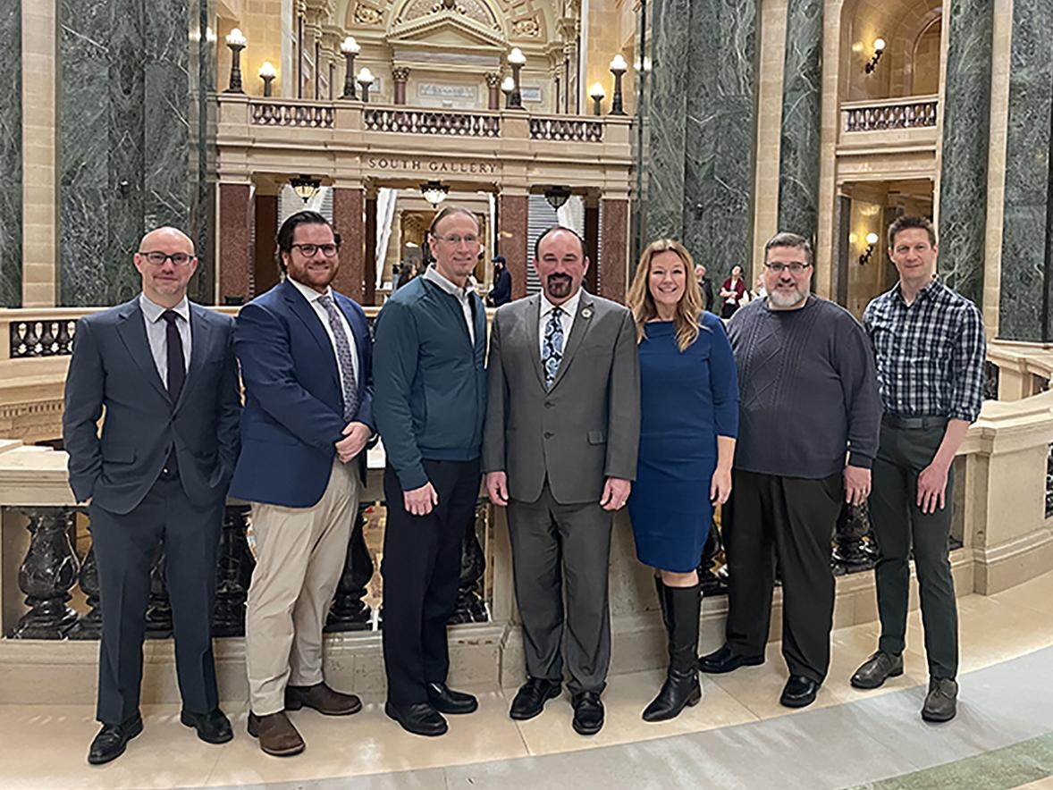 Along with UW-Stout Professor Andrew Williams, right, those who testified at the state Capitol in favor of the digital interactive media bill are, from left, Nathaniel Blair, Krafton games; Andrew O’Connor, Entertainment Software Association; Brian Raffel, Raven Software; Rep. Clint Moses, of Menomonie; Jennifer Javornik, Filament Games; and Tim Gerritson, Lost Boys Interactive.