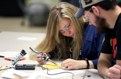 UW-Stout student in an electrical circuits course in a tech ed lab.