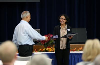 award recipient accepting award from interim provost Rodríguez at 2016 retirement reception