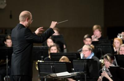 Director Aaron Durst conducts the Symphonic Band.